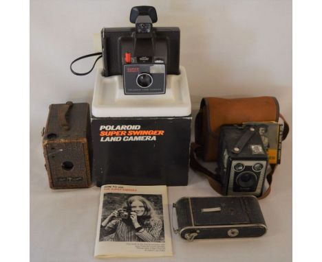 4 vintage cameras including a Polaroid Super Swinger &amp; a Puck