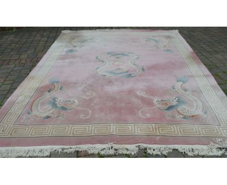 Large pink ground Chinese carpet with dragon motifs 370cm by 280cm