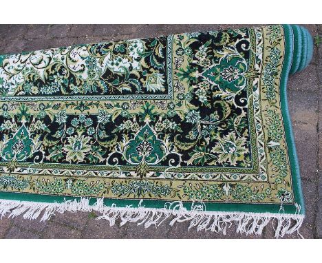 Large jute carpet on green ground approx. size 4m by 3m