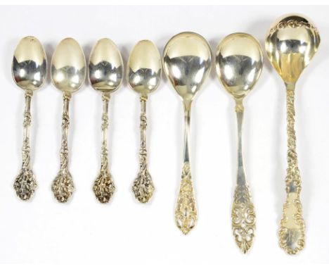 A SMALL QUANTITY OF ORNATE NORTH AMERICAN SILVER FLATWARE INCLUDING A CREAM LADLE, ETC, EARLY 20TH CENTURY, 4OZS