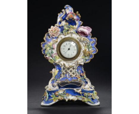 A COALPORT 'COALBROOKDALE' BLUE GROUND FLORAL ENCRUSTED CLOCK AND STAND,C1835 crested by a brightly plumaged bird, the back o