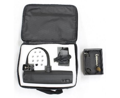 Fishman BP-100 acoustic bass pickup in original box; also a Konig &amp; Meyer 12285 music stand light in original case (2) 