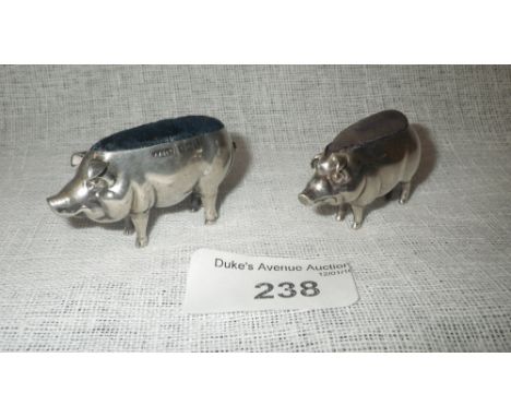 AN EDWARDIAN NOVELTY PIN-CUSHION modelled in the form of a pig, by Adadie & Lovekin, Birmingham 1907, 2" long x 1" high and a