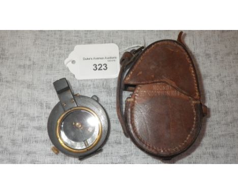 A MILITARY COMPASS in leather case, stamped 'T. French & Son', London 1917