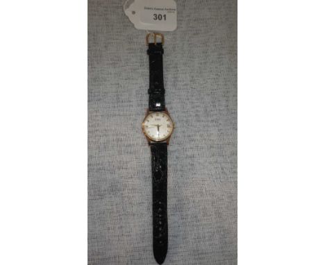 TECHNOF: A GENTLEMAN'S 9CT YELLOW GOLD WRISTWATCH, the round dial with raised baton and Arabic numerals, sweep seconds hand a