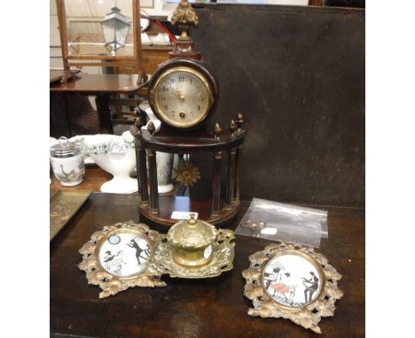 A SMALL MAHOGANY AND GILT MOUNTED CLOCK of architectural design, a brass inkwell and two stamped brass picture frames