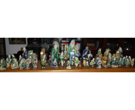 A LARGE COLLECTION OF ORIENTAL CERAMIC FIGURES