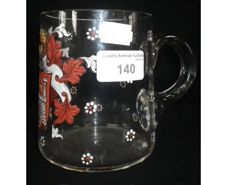 A CLEAR GLASS MUG with enamel armorial