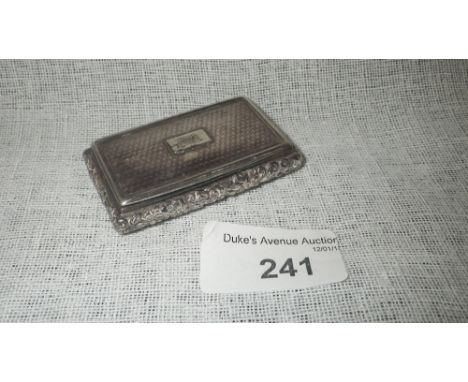 A VICTORIAN SNUFF BOX of rectangular cushion form, with an engine-turned cover, initialled, with raised foliate borders and g