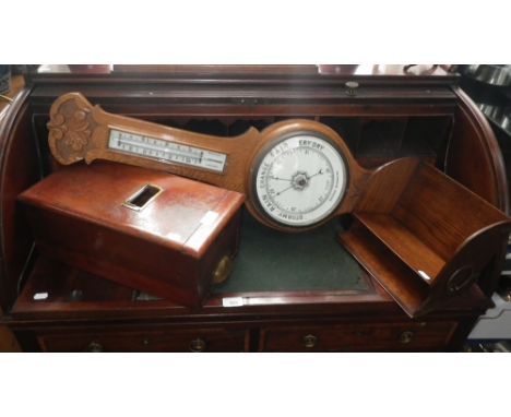 AN OAK BANJO BAROMETER, an oak book rack and a wooden shop till