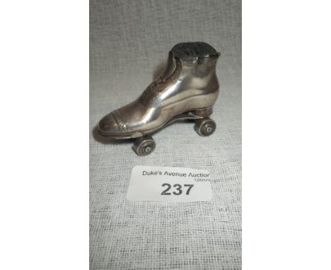 AN EDWARDIAN NOVELTY PIN-CUSHION modelled in the form of a roller skate, engraved with a registration number, by Chrisford & 
