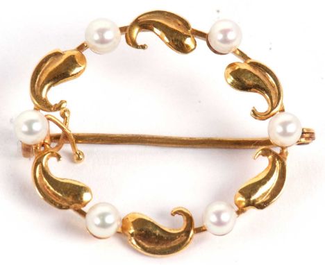 A 14ct cultured pearl wreath brooch, the round cultured pearls, alternating with curled leaves, inscribed 585 to frame, 3cm l