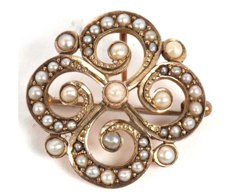 A 9ct split pearl brooch/pendant, the quatrefoil shaped brooch set throughout with graduated split pearls, set to reverse wit