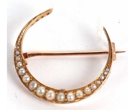 A late Victorian 15ct split pearl crescent brooch, set with graduated split pearls, stamped 15 and 625 to reverse, hallmarked