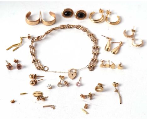 A quantity of assorted unmarked yellow metal jewellery to include a quantity of earrings and a gate bracelet with clasp only 