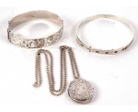 A silver hinged bangle with engraved decoration to upper half, hallmarked Birmingham 1941, 1.5cm wide, together with a silver