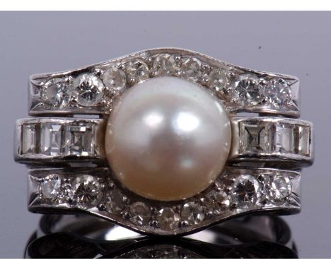 Precious metal pearl and diamond cocktail ring centering a cultured pearl (8mm diameter), raised above three shaped bands set
