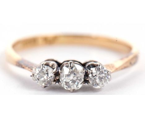 An 18ct and platinum three stone diamond ring, the slightly graduated old mine cut diamonds, total estimated approx. 0.46cts,