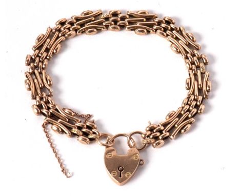 A 9ct fancy gate link style bracelet, engraved decoration to alternating sections of links, jump ring to either end stamped 9