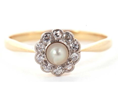 An 18ct cultured pearl and diamond cluster ring, the central cultured pearl surrounded by round brilliant cut diamonds, all s