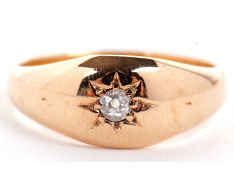 A late Victorian 15ct single stone diamond ring, the old mine cut diamond, gypsy set to a plain tapering band stamped 15 .625