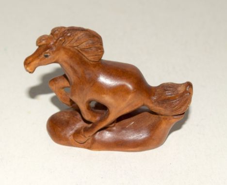 Japanese wooden horse shaped netsuke signed to the base