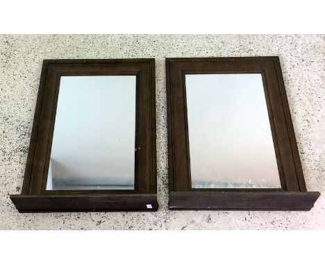 Two wall mirrors with fold out shelf