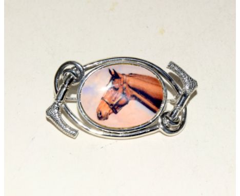 Silver brooch with enamel image of a horse