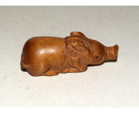 Japanese wooden pig netsuke signed to the base