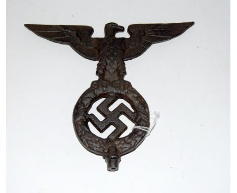 A reproduction Third Reich cast iron Nazi Eagle standard finial 19.5cms wide by 17cms high 
