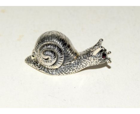 Unusual silver figure of a snail with ruby eyes