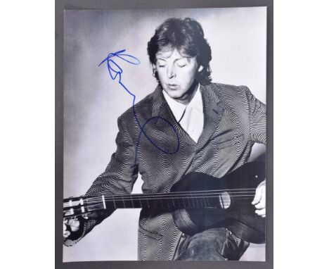 The Beatles - Sir Paul McCartney - autographed 8x10" black and white photograph of McCartney playing guitar. Signed in blue i