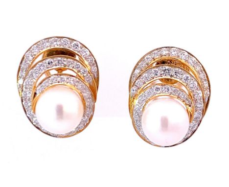 Pair of clip earrings featuring 3 arcs of sparkling diamonds supported by 18k yellow gold surrounding a lustrous 9 mm Akoya p