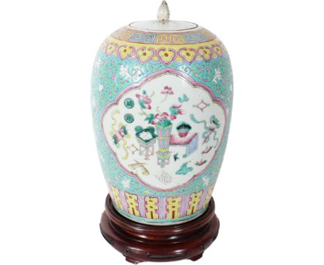 Chinese Ginger Jar w Lid. Loss to the enamel near the top. Size: 8 1/2 x 13 in. Height with base is 15 3/4 in.