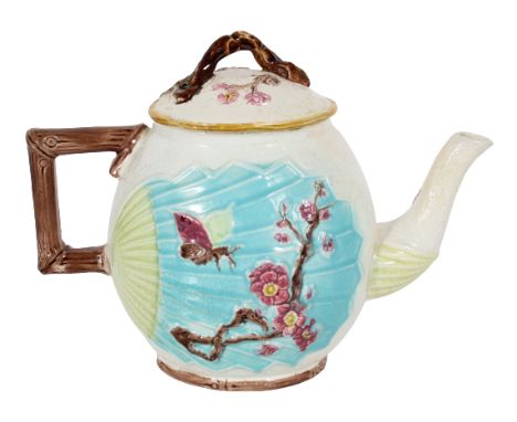 English Majolica Teapot. Decorated with Japanese cherry blossoms, hummingbird and butterfly. These patterns reflected the ris