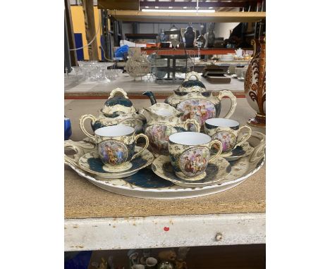 A DECORATIVE VICTORIA TEA SET TO INCLUDE MATCHING TRAY, TEAPOT, MILK JUG, SUGAR BASIN, THREE CUPS AND SAUCERS. 