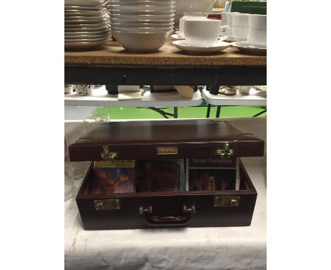 A BRIEFCASE CONTAINING A QUANTITY OF FICTION AND NON FICTION BOOKSTO INCLUDE HARRY POTTER, ROYAL DOULTON, GUIDE BOOKS, ETC 