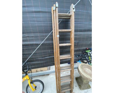 A VINTAGE THREE SECTION 21 RUNG WOODEN LADDER 