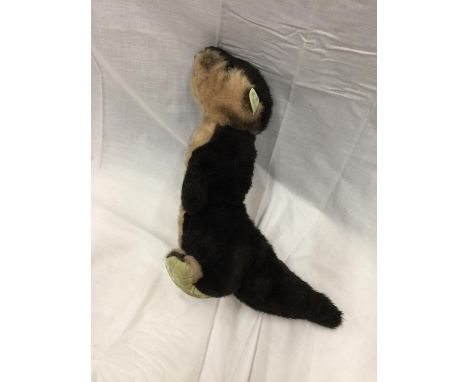 A VINTAGE MERRYTHOUGHT BEAR IN THE FORM OF AN OTTER 