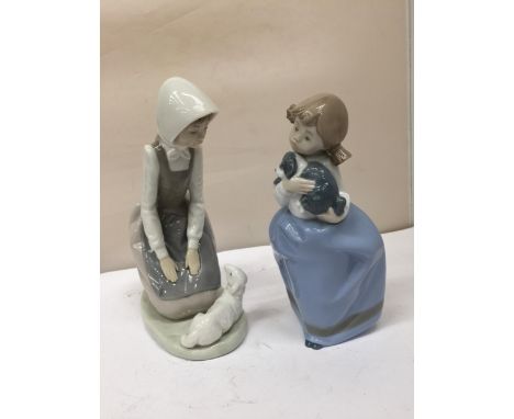 TWO NAO FIGURINES TO INCLUDE A GIRL AND A DOG AND A GIRL AND A LAMB 