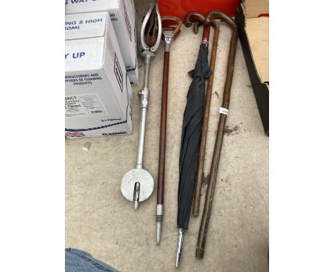 TWO WALKING STICKS, TWO STICK SEATS AND AN UMBRELLA 