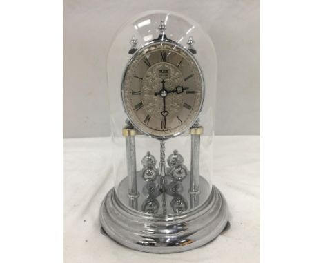 A GLASS DOMED MANTLE CLOCK 