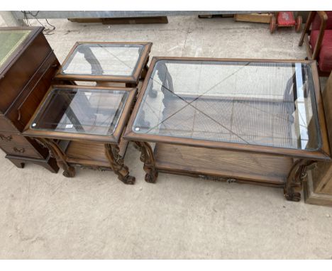 A PAIR OF GLASS TOPPED LAMP TABLES AND A MATCHING COFFEE TABLE 