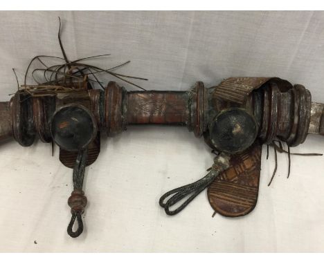 AN AFRICAN - POSSIBLY SUDANESE- KNIFE IN A DECORATED LEATHER SCABBARD APPROX LENGTH 84CM 