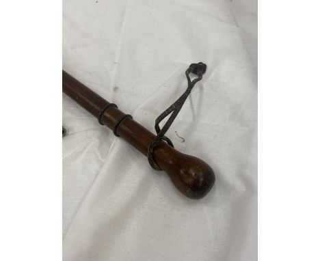 A VINTAGE MAHOGANY WALKING CANE AND THE VINTAGE METROPOLITAN WHISTLE 