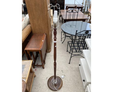 A MODERN STANDARD LAMP WITH TURNED COLUMN 