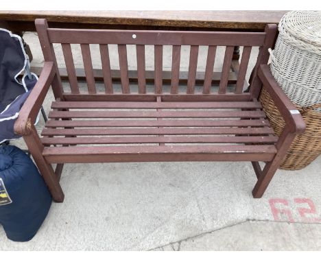 A WOODEN SLATTED GARDEN BENCH 
