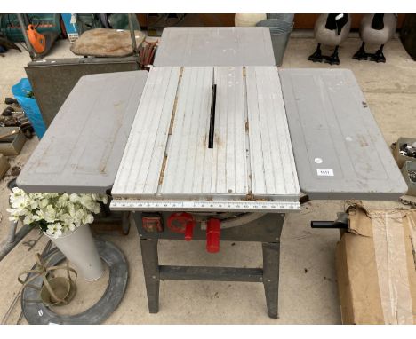 AN ELECTRIC TABLE BENCH SAW 