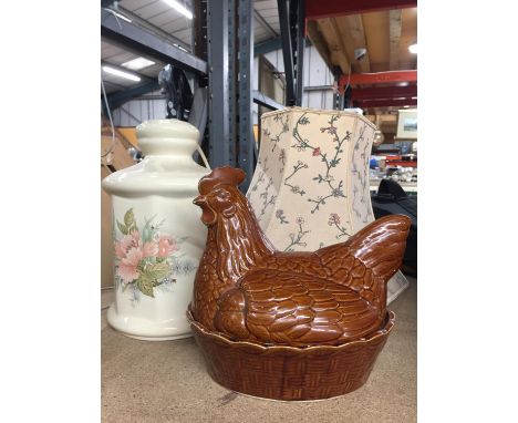A FLORAL LAMP BASE AND SHADE AND AN EGG CROCK IN THE SHAPE OF A HEN 