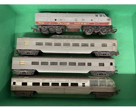 A TRI-ANG RAILWAYS CANADIAN PACIFIC ENGINE AND THREE CARRIAGES 